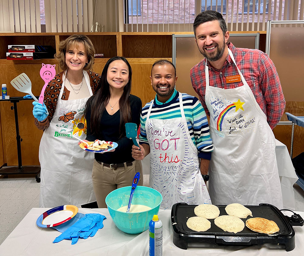 care counselor making breakfast