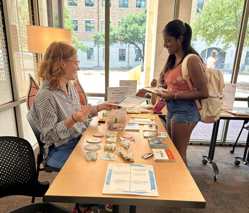 Grace works at the Longhorn Wellness Center Passport to Wellness event.