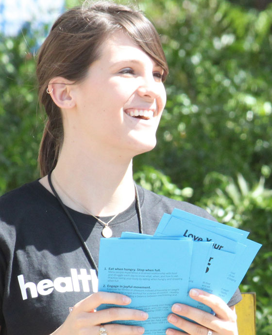 Volunteer giving out pamphlets