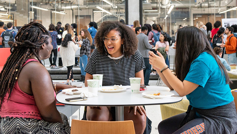 group of 3 students laughing